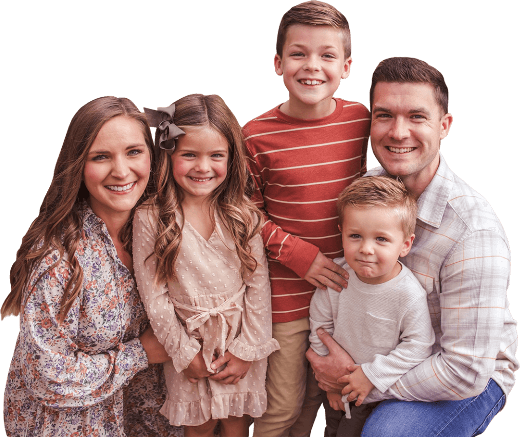 The Sell family smiles for a group photograph.