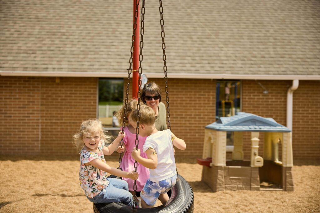 Abiding Savior Lutheran School preschool class on the tire swing.