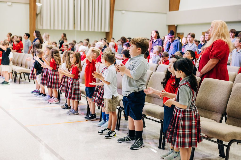 Abiding Savior Lutheran School students stand for worship during their Faith Formation.