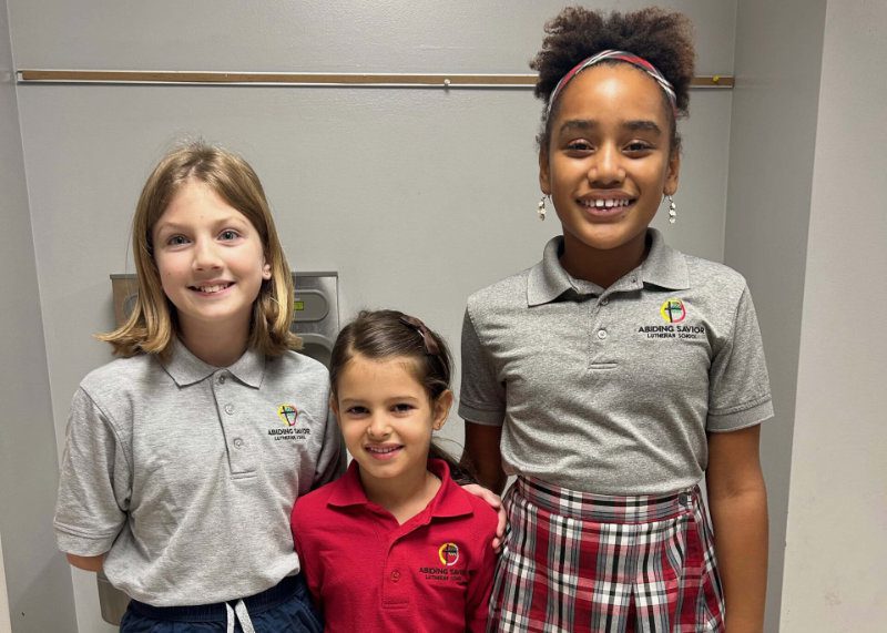 Students smile for a photo at Abiding Savior Lutheran School.